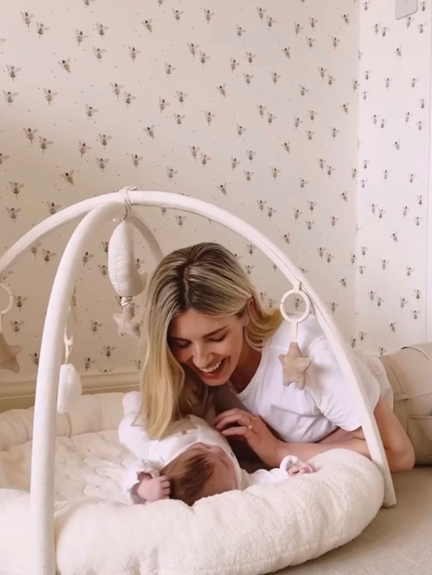 Mollie King in Baby Liliana's Neutral Nursery with Ducks in a Row Fairy Dust Wallpaper
