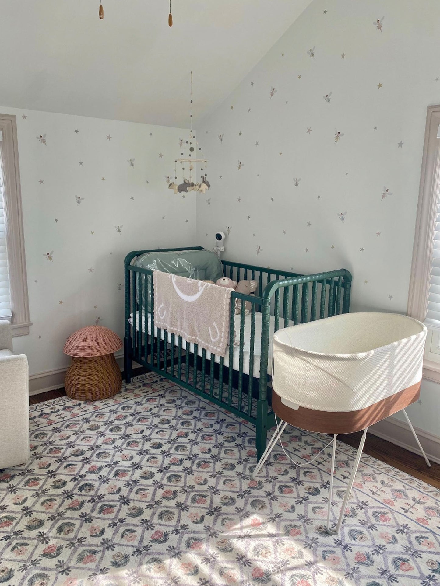 Fairy and Stars Wall Stickers in Scandinavian Style Baby Girl Nursery with green cot,Moses basket and patterned rug