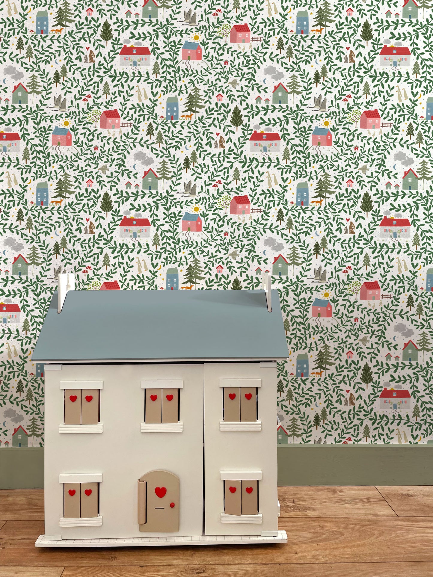 English Country Cottages Luxury Children's Wallpaper with green painted skirting board and Dollhouse with heart shutters